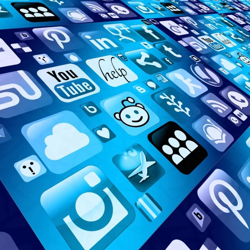 Array of blue social media icons floating in a grid, representing platforms like YouTube, Reddit, Instagram, and Facebook.